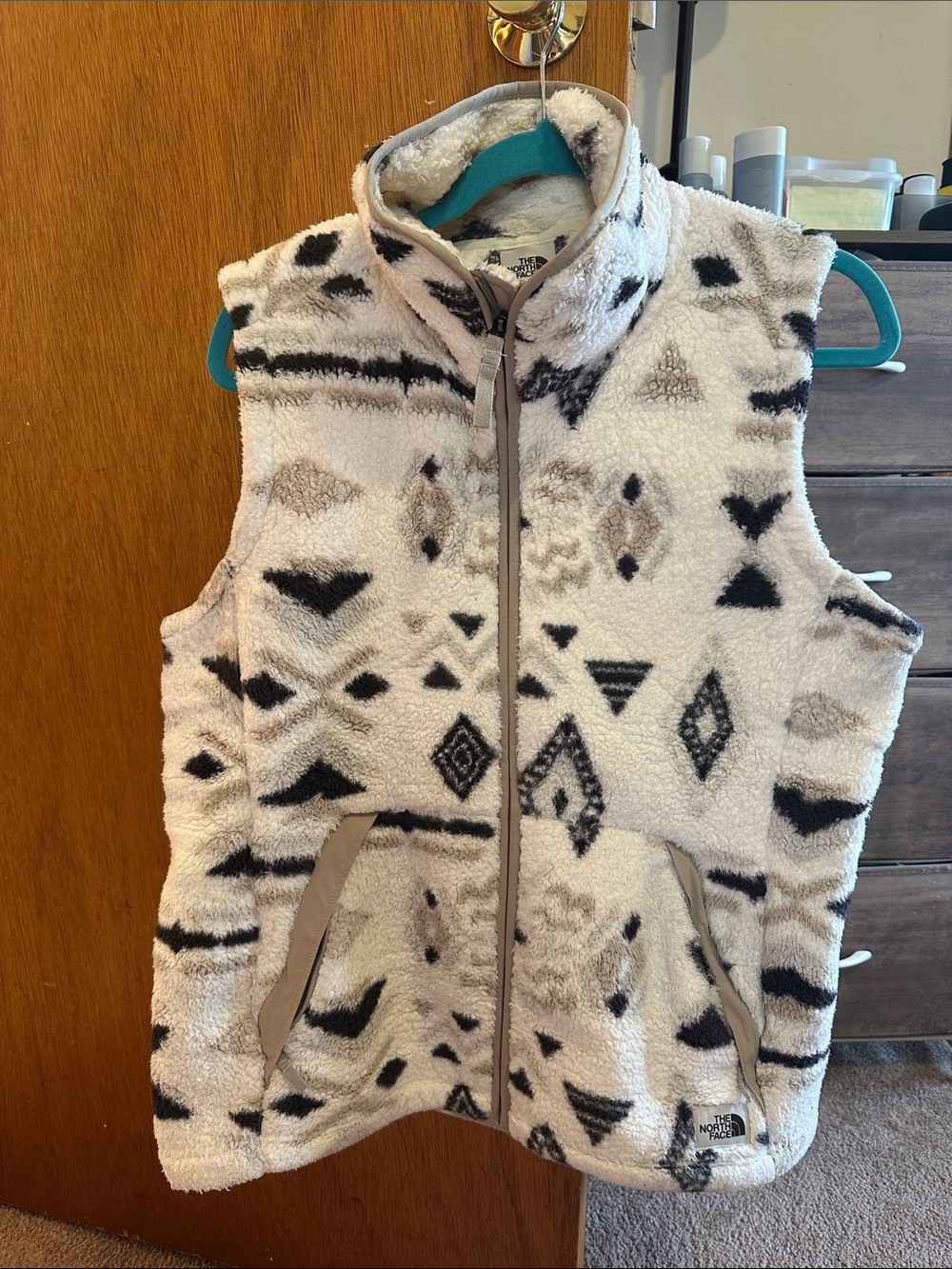 The North Face Cream Sherpa Vest with Black & Gray Geometric Print